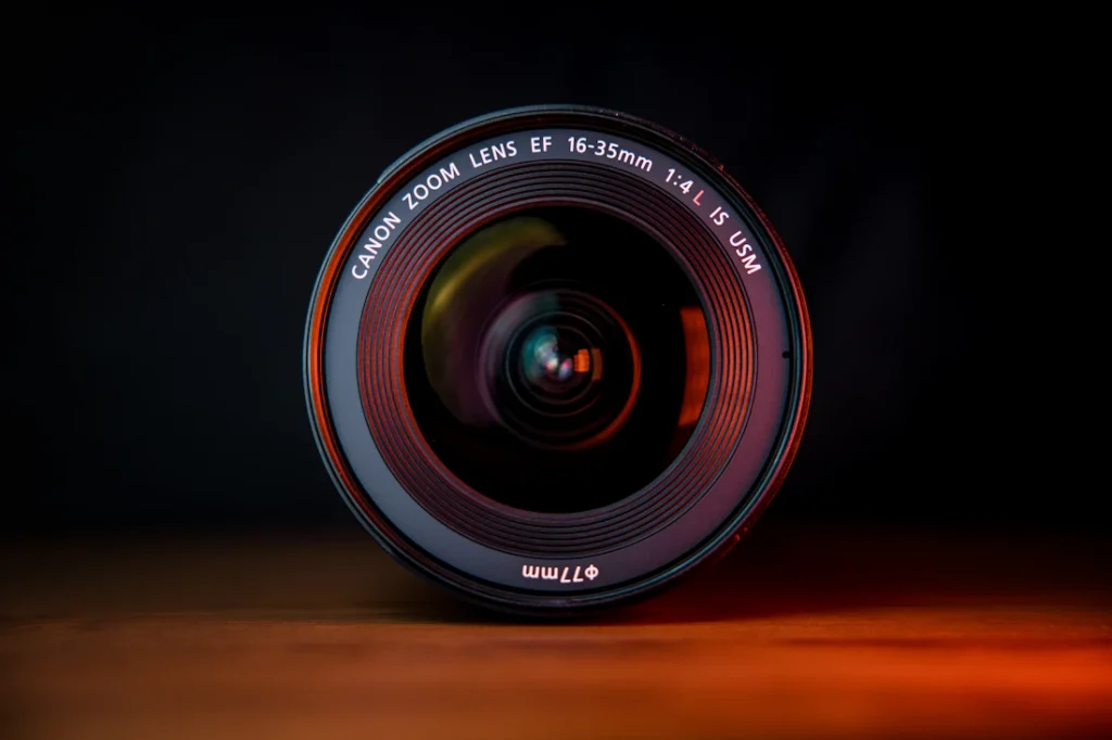 A camera lens on a wooden table